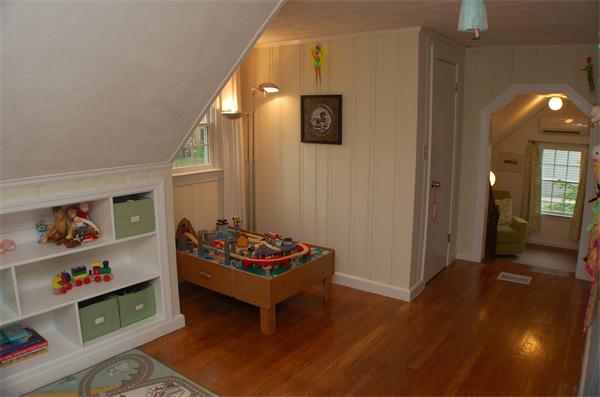86 Arch Street Needham, MA 02492 - Photo 16 of 24 a living room with furniture and a wooden floor