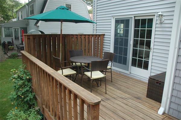 86 Arch Street Needham, MA 02492 - Photo 20 of 24 a balcony with table and chairs