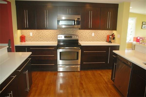 86 Arch Street Needham, MA 02492 - Photo 2 of 24 a kitchen with a sink appliances and cabinets