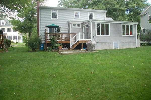 86 Arch Street Needham, MA 02492 - Photo 22 of 24 a house view with a garden space