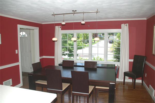 86 Arch Street Needham, MA 02492 - Photo 4 of 24 a view of a dining room with furniture and wooden floor