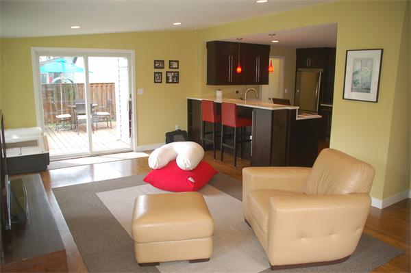 86 Arch Street Needham, MA 02492 - Photo 6 of 24 a living room with furniture and a flat screen tv