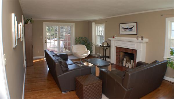86 Arch Street Needham, MA 02492 - Photo 7 of 24 a living room with furniture a large window and a fireplace