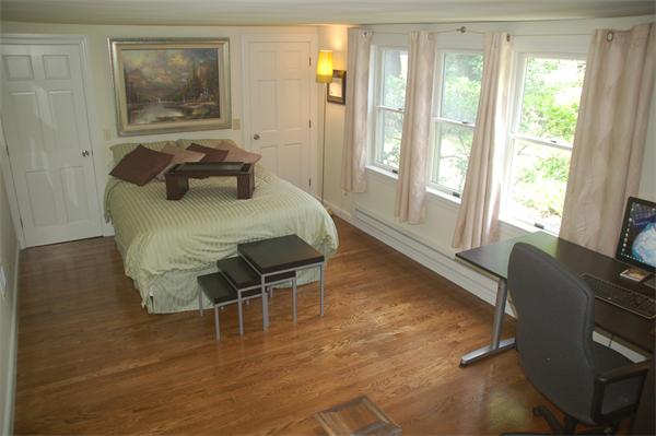 86 Arch Street Needham, MA 02492 - Photo 9 of 24 a bedroom with furniture and a window