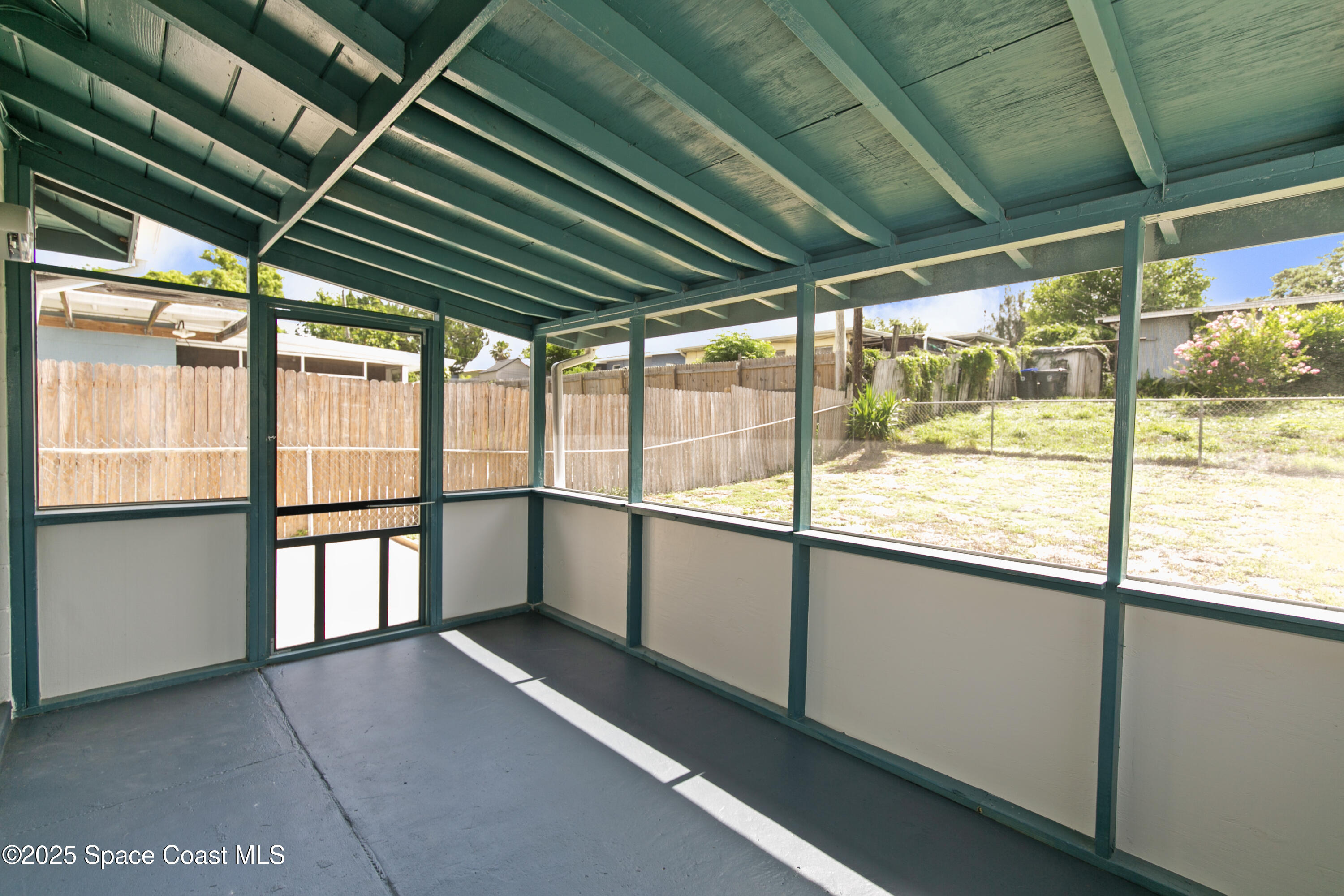 905 North Carpenter Road Titusville, FL 32796 - Photo 21 of 27 a view of an empty room with a window