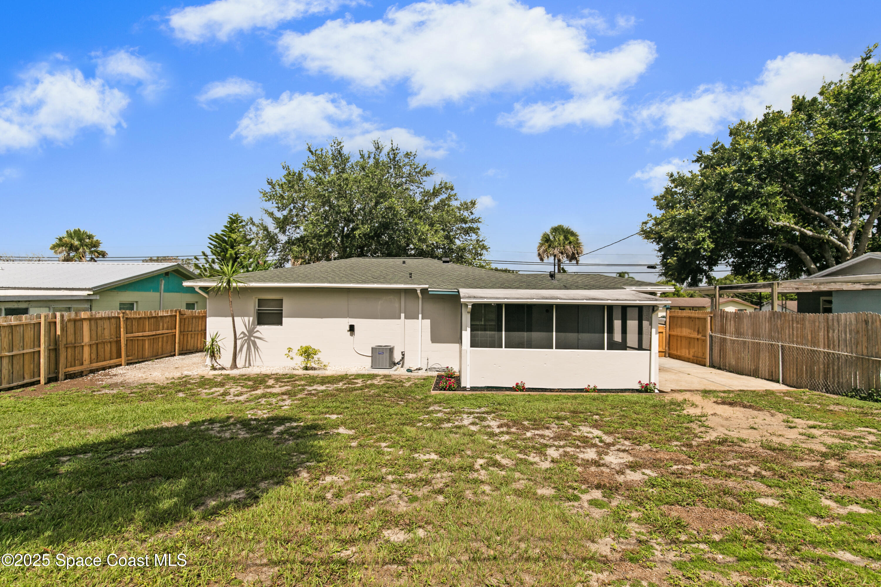 905 North Carpenter Road Titusville, FL 32796 - Photo 24 of 27 a front view of a house with a yard