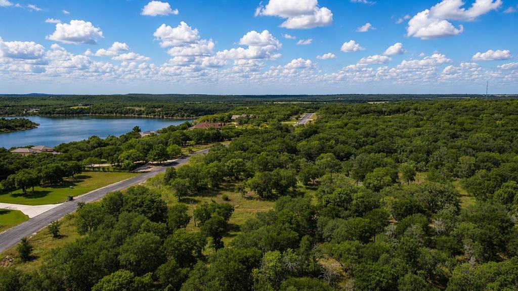 274 Ridgeline Drive Chico, TX 76431 - Photo 4 of 9 a view of a lake with sunset