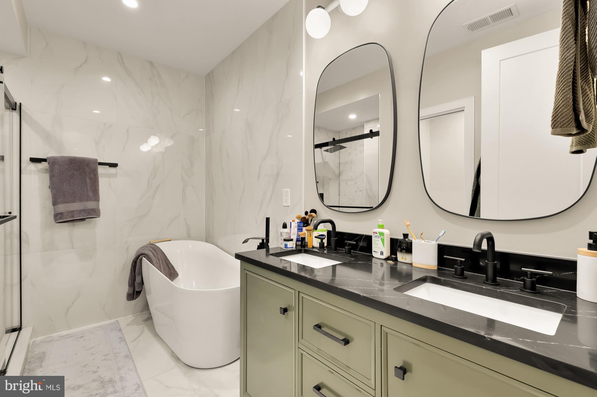 3361 18th Street Northwest Washington, DC 20010 - Photo 22 of 49 a bathroom with a double vanity sink and a mirror