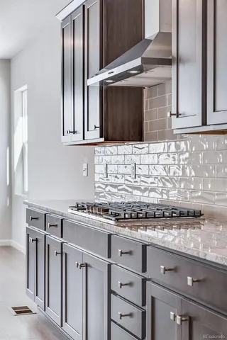 a close view of a faucet a sink and a window