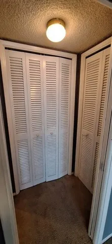 a bathroom with a toilet a sink and shower