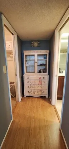 a bedroom with a bed and a mirror