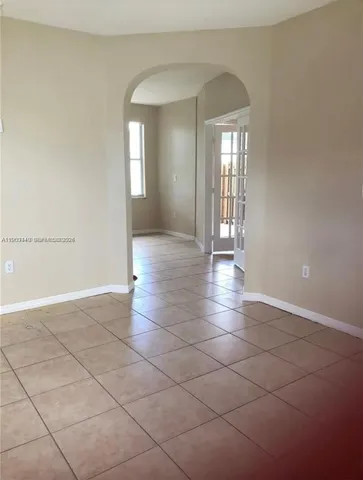 a view of an empty room and window in a room