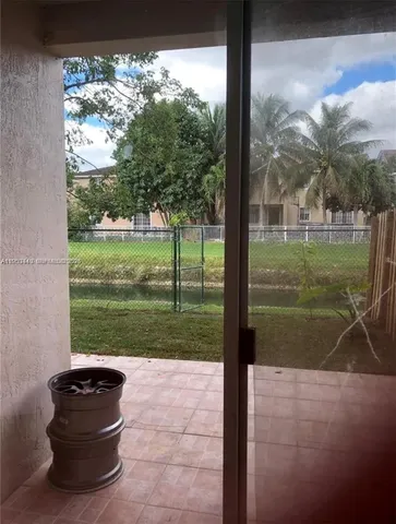 a view of a back yard from a balcony