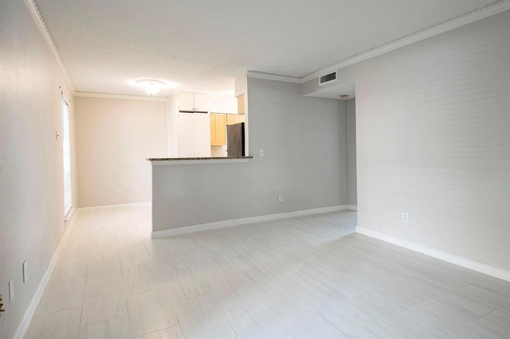 5812 Milton Street, Unit 105 Dallas, TX 75206 - Photo 2 of 12 a view of an empty room