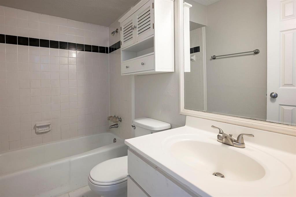 5812 Milton Street, Unit 105 Dallas, TX 75206 - Photo 8 of 12 a bathroom with a sink toilet and shower