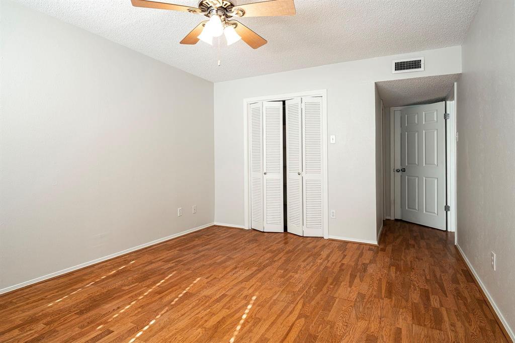 5812 Milton Street, Unit 105 Dallas, TX 75206 - Photo 10 of 12 a view of empty room with wooden floor