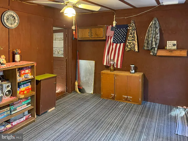 a room with wooden floor and furniture