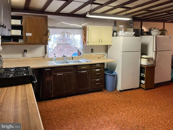 a view of storage and utility room with washer and dryer