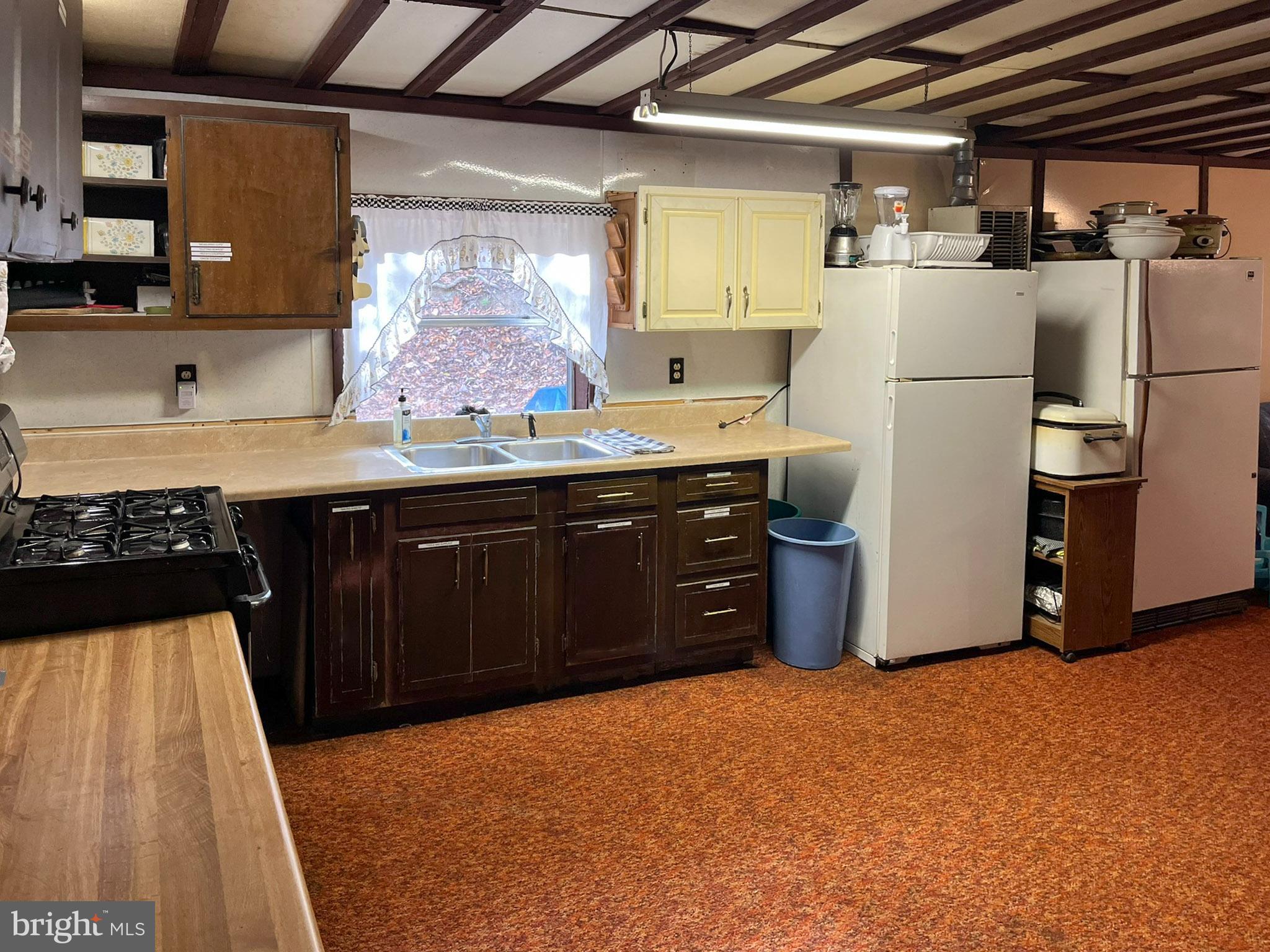 9766 Valley View Road Three Springs, PA 17264 - Photo 16 of 40 a kitchen with refrigerator and window