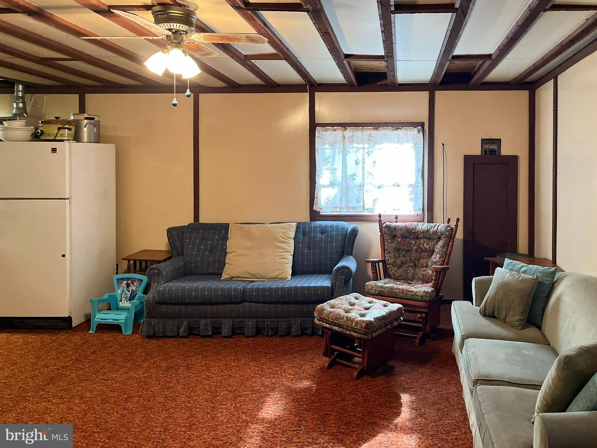 9766 Valley View Road Three Springs, PA 17264 - Photo 19 of 40 a living room with furniture and a large window