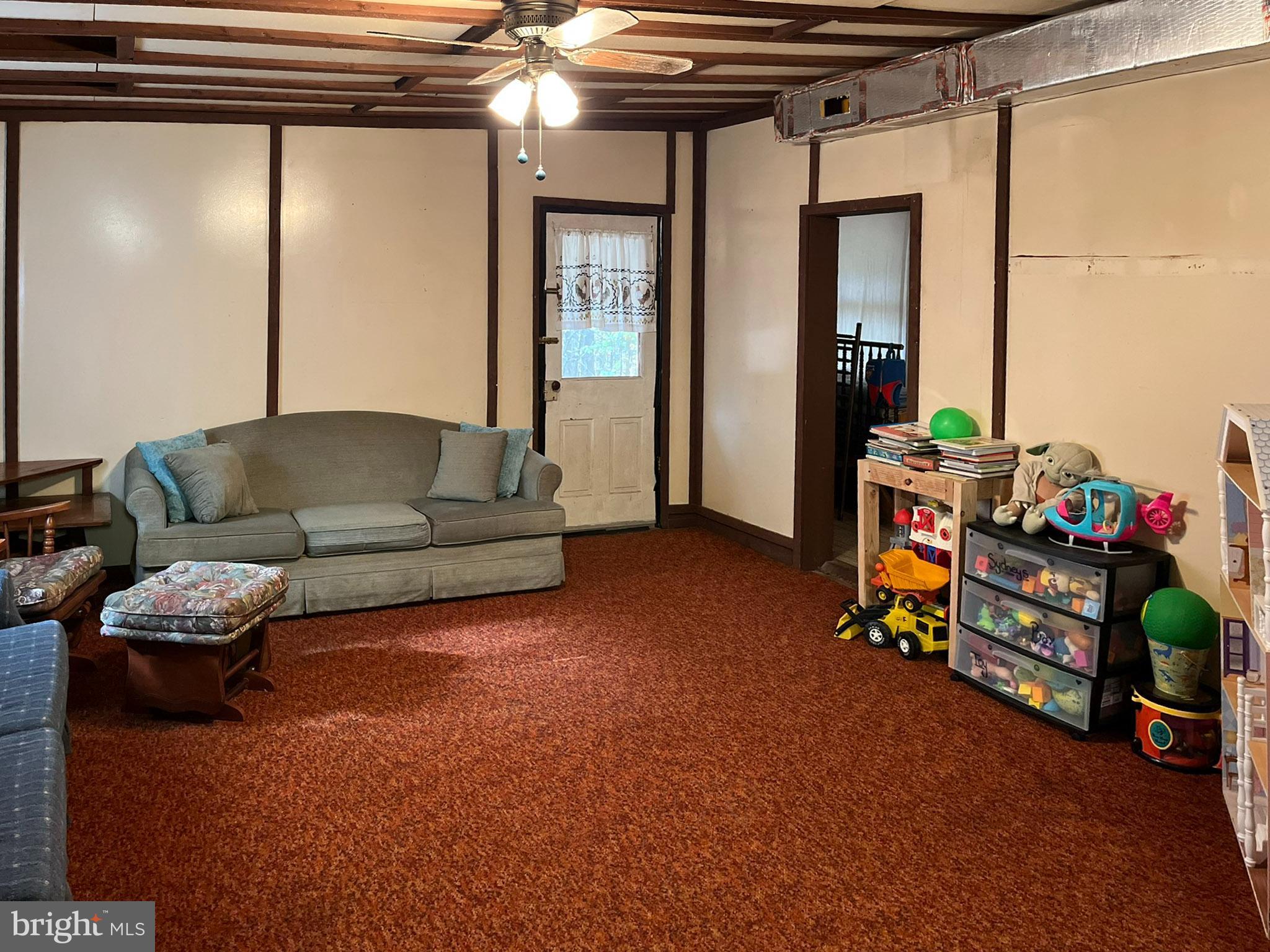 9766 Valley View Road Three Springs, PA 17264 - Photo 20 of 40 a living room with furniture and a dining table