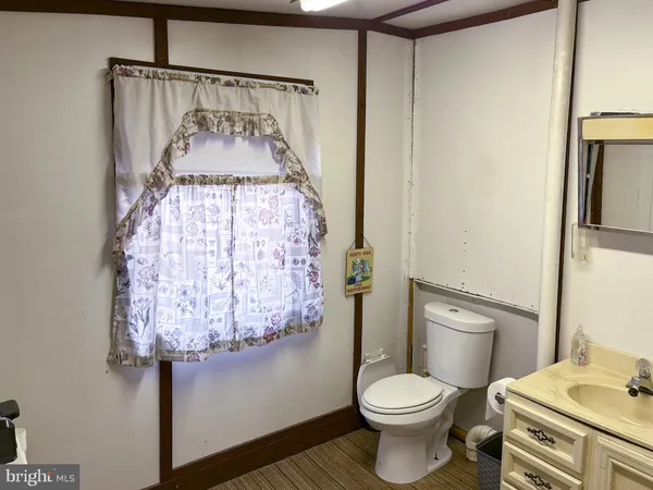 a sign that is sitting in the forest