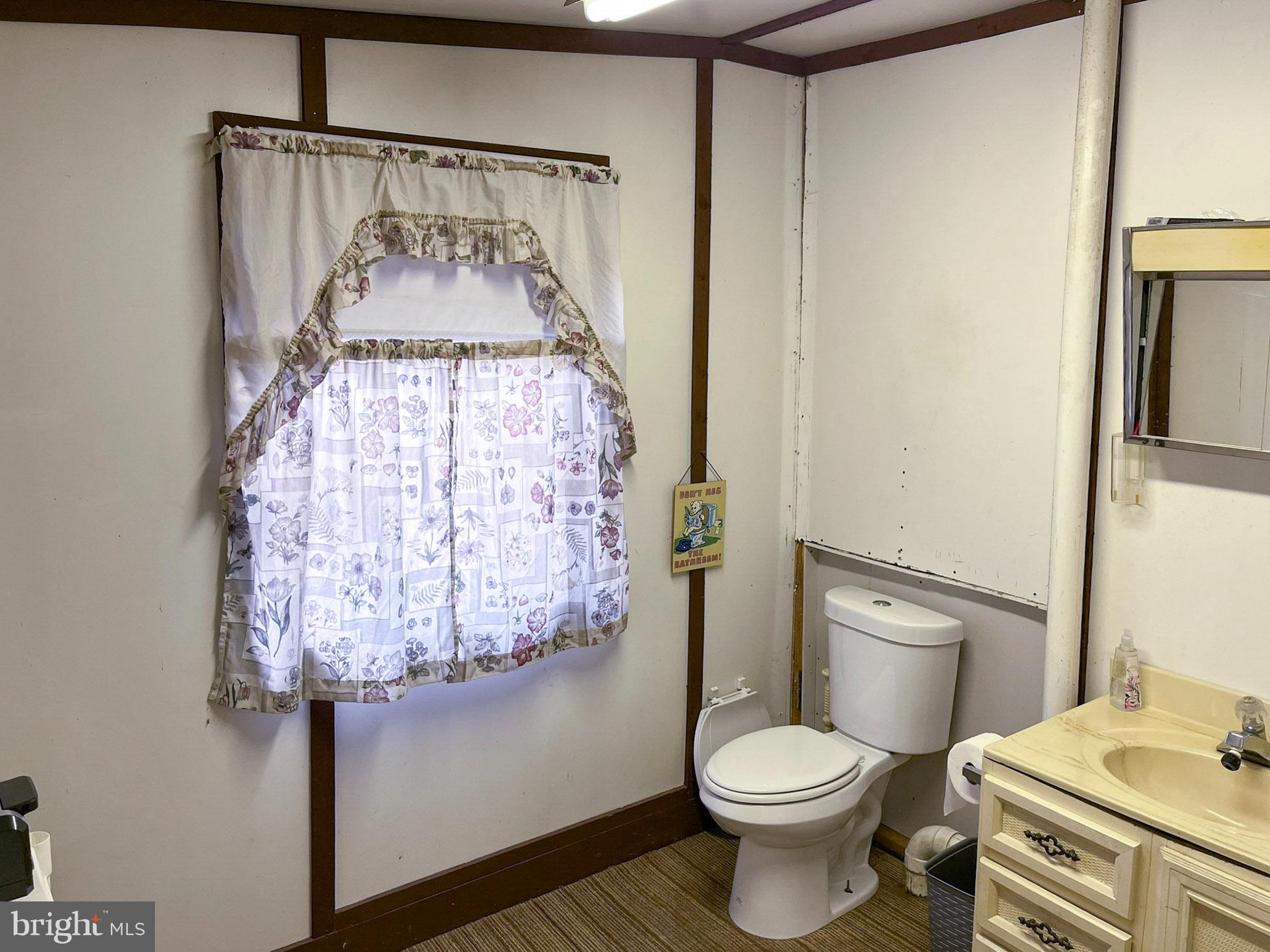 9766 Valley View Road Three Springs, PA 17264 - Photo 25 of 40 a bathroom with a toilet sink and shower