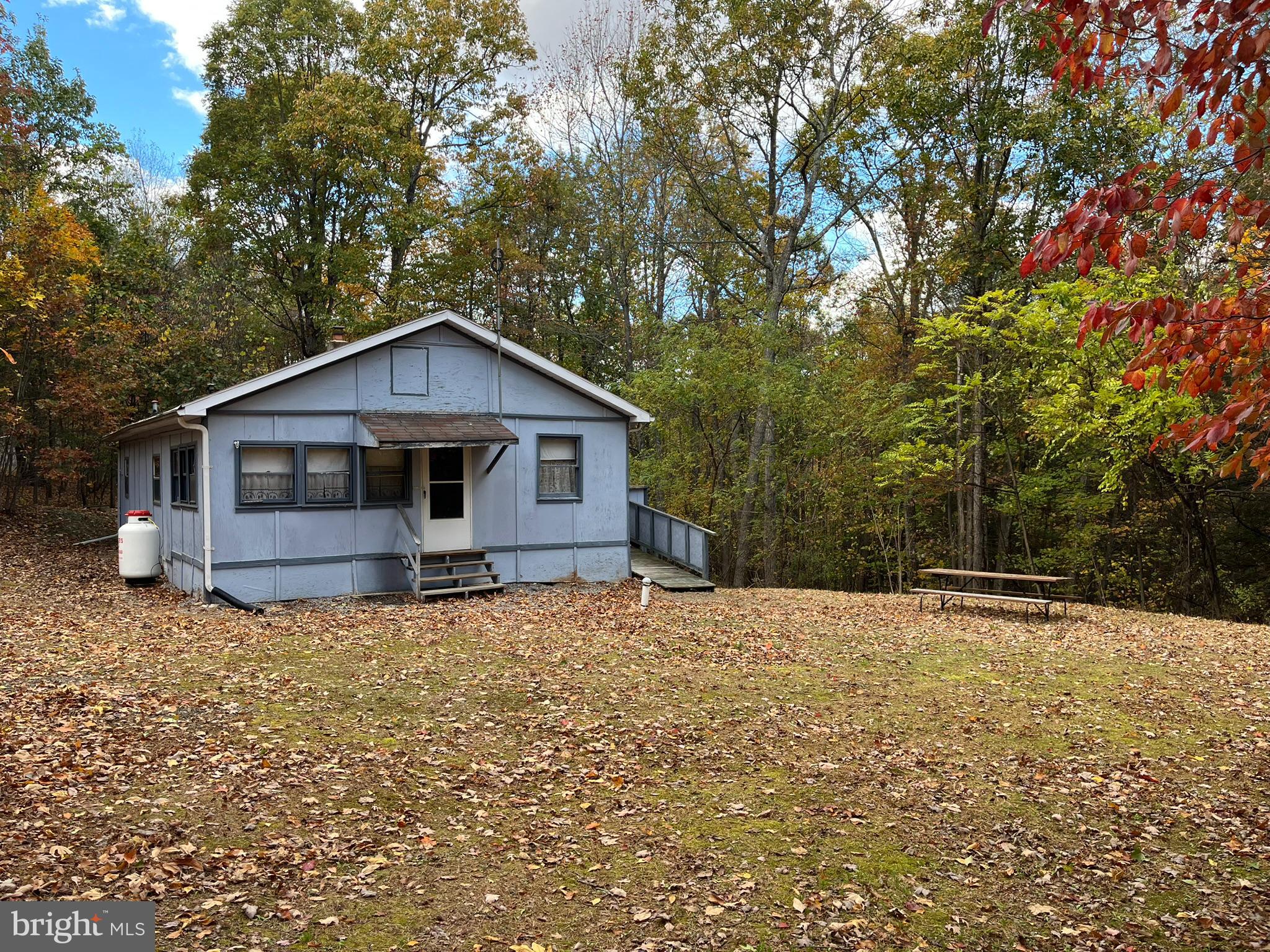 9766 Valley View Road Three Springs, PA 17264 - Photo 3 of 40 a white house that has a tree in front of it