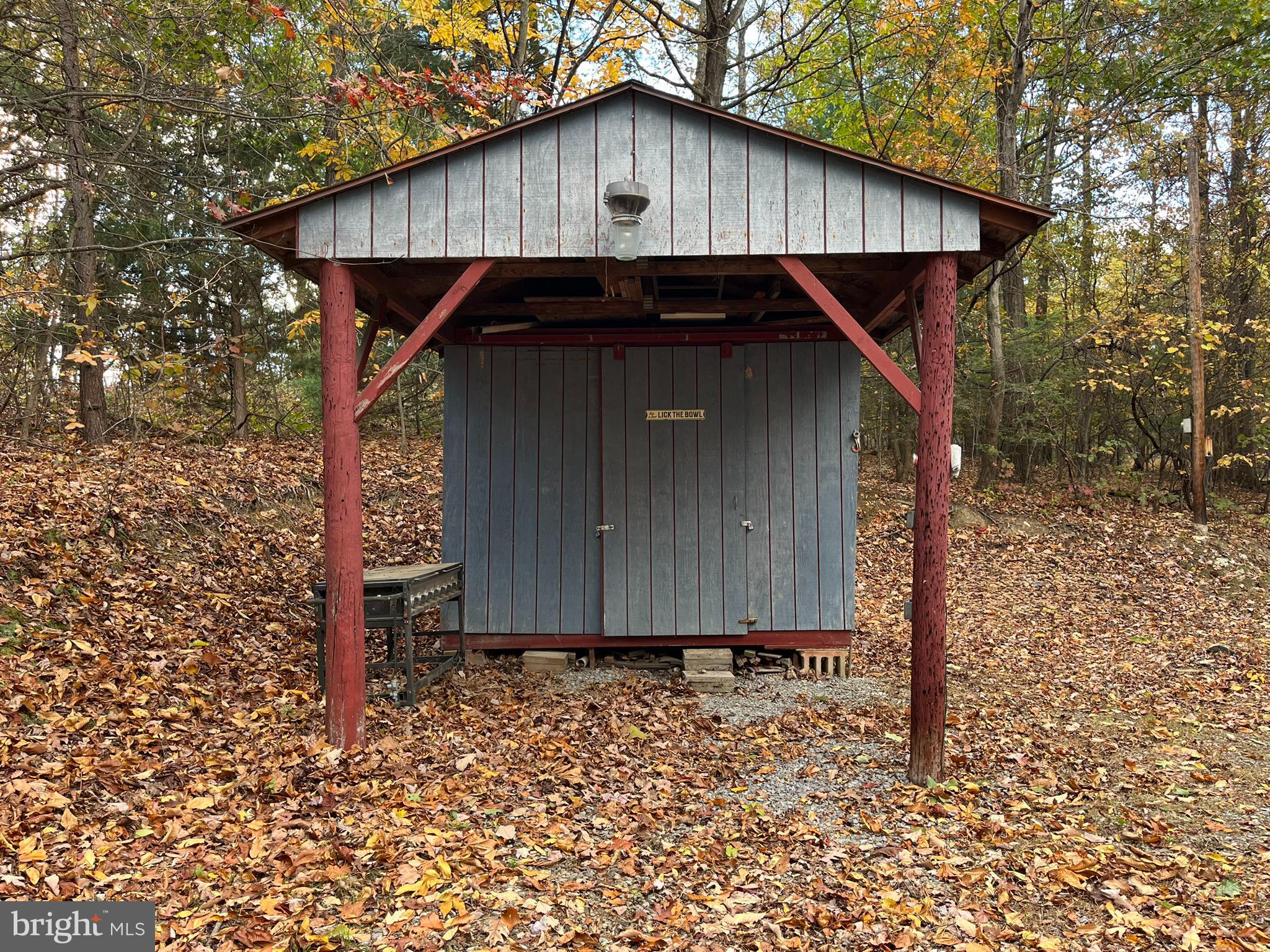 9766 Valley View Road Three Springs, PA 17264 - Photo 9 of 40 a wooden house with a small yard