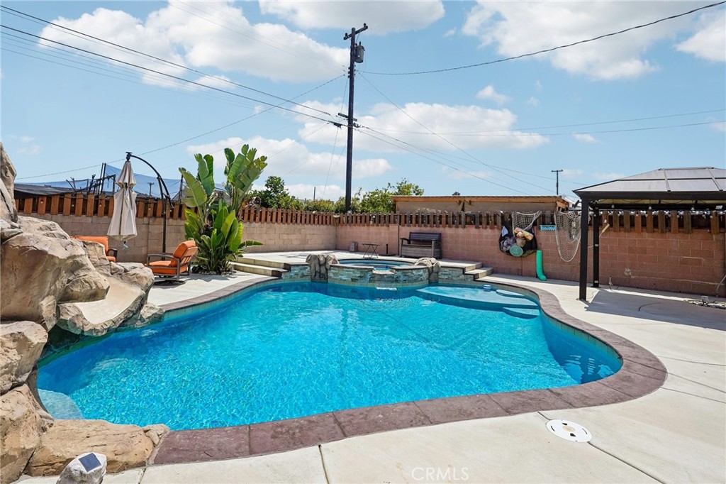 6412 Shawnee Road Westminster, CA 92683 - Photo 33 of 36 a view of a swimming pool with a lounge chair