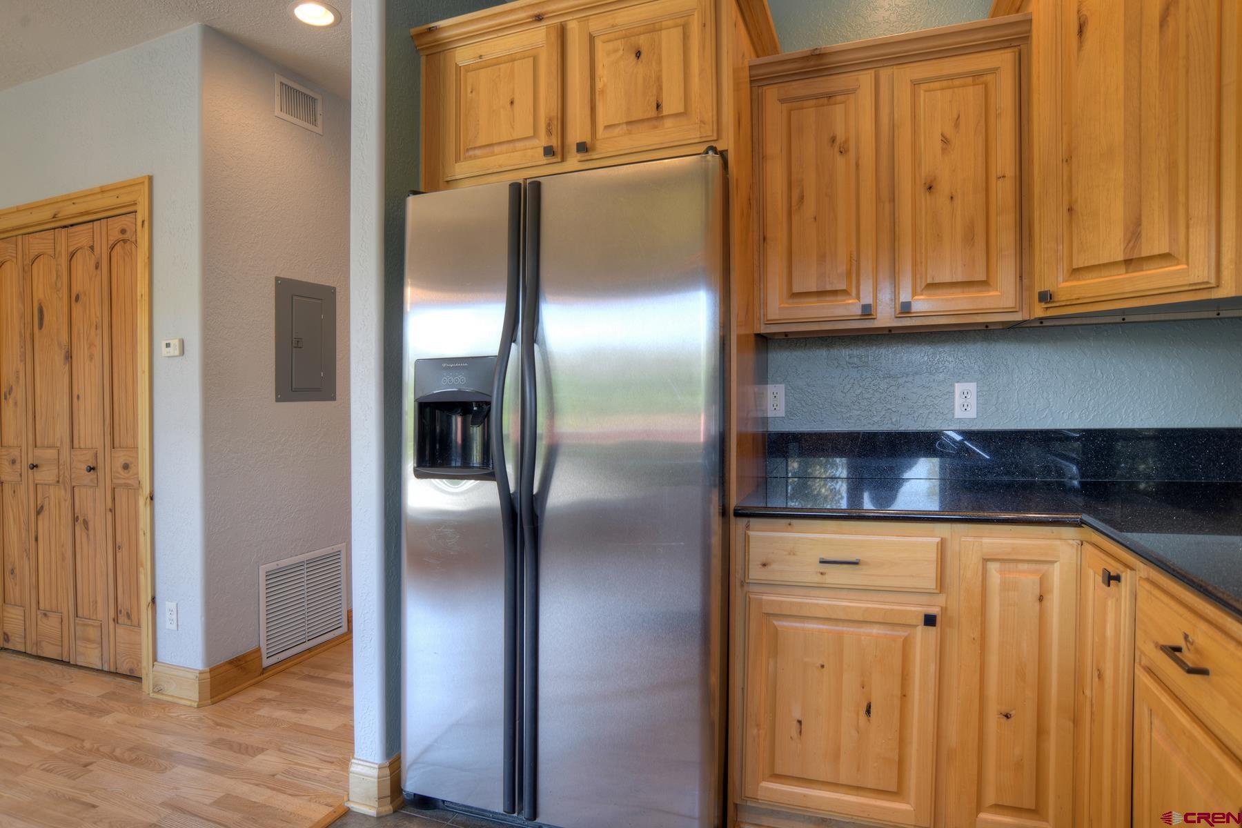 2855 Main Avenue, Unit A204 Durango, CO 81301 - Photo 11 of 45 a kitchen with stainless steel appliances granite countertop a refrigerator and cabinets