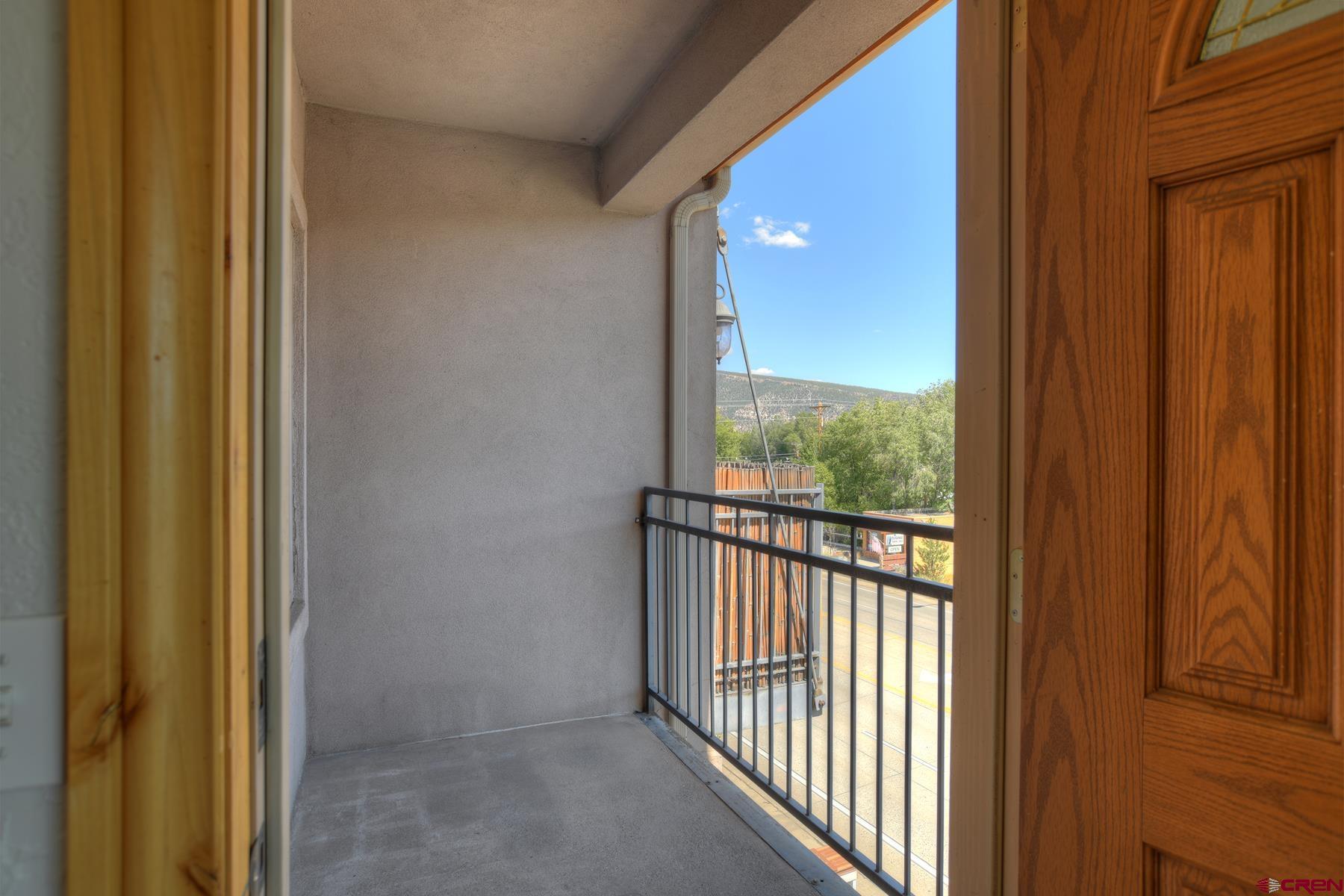 2855 Main Avenue, Unit A204 Durango, CO 81301 - Photo 21 of 45 a view of a glass door with a balcony from a door