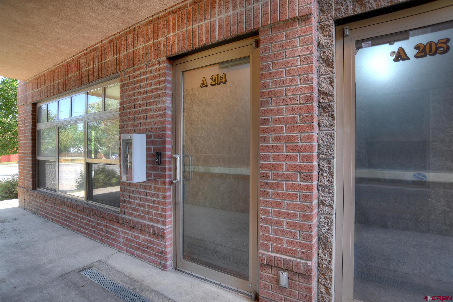2855 Main Avenue, Unit A204 Durango, CO 81301 - Photo 33 of 45 a view of a brick house with a large window