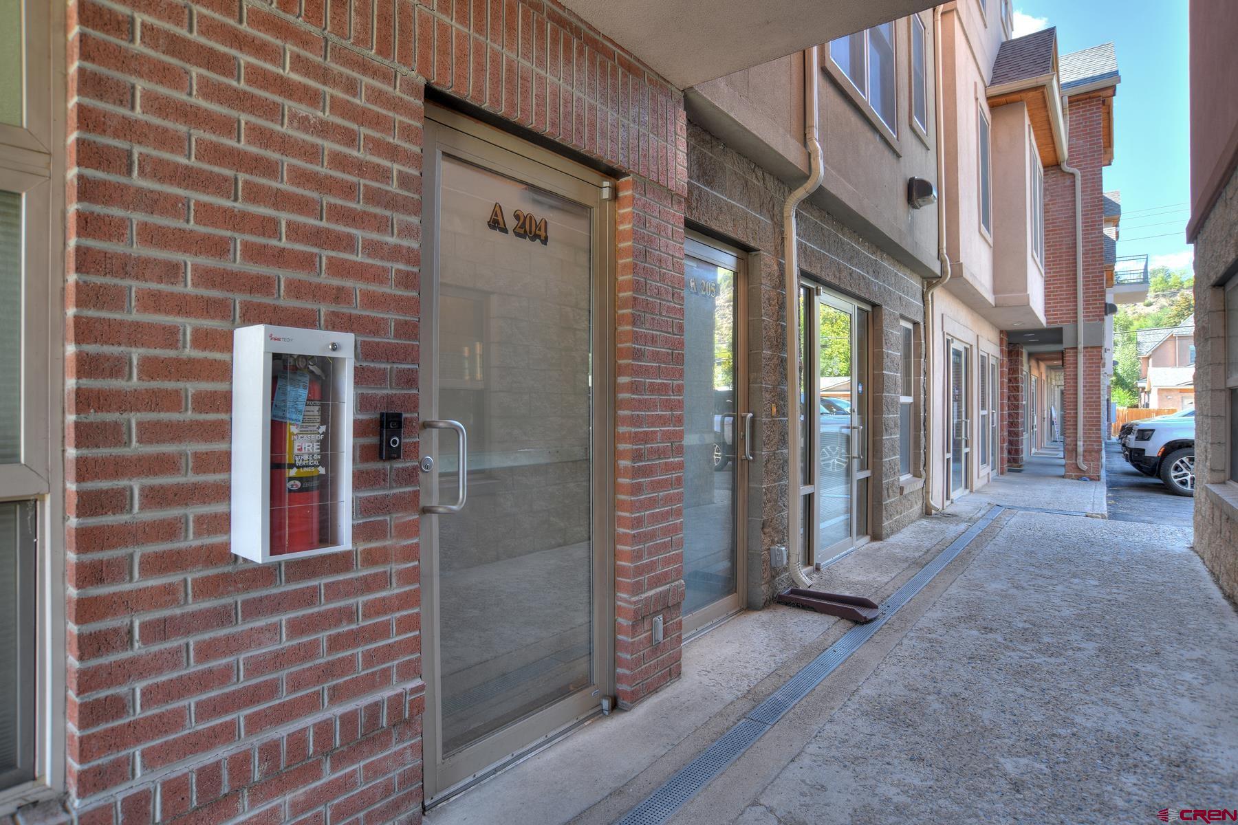 2855 Main Avenue, Unit A204 Durango, CO 81301 - Photo 34 of 45 a view of a brick building with many windows
