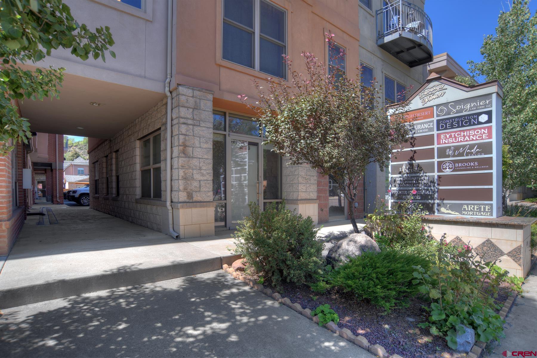 2855 Main Avenue, Unit A204 Durango, CO 81301 - Photo 35 of 45 a view of a building with a yard