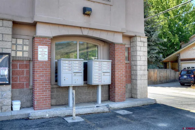 a view of a cars parked in front of a building