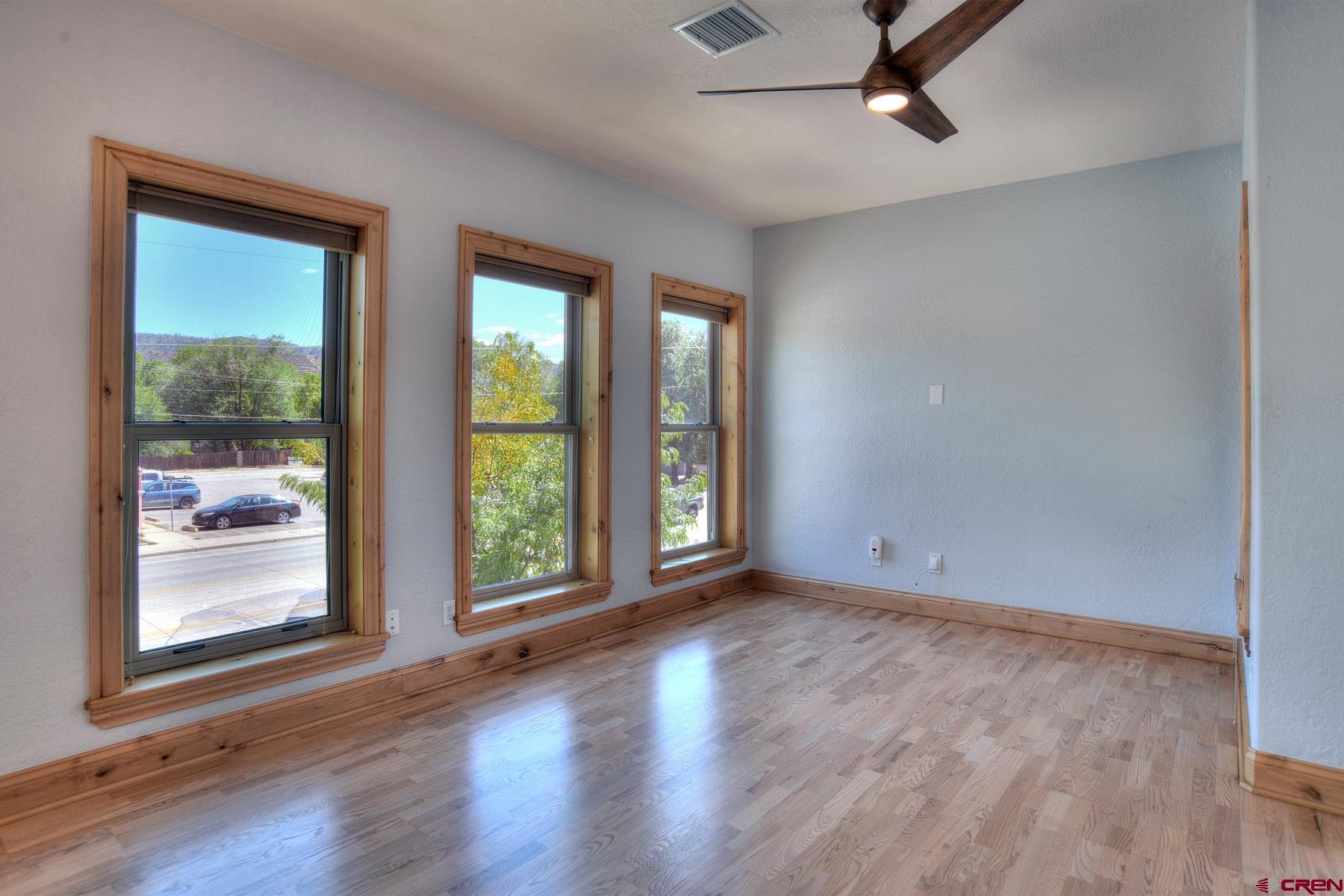 2855 Main Avenue, Unit A204 Durango, CO 81301 - Photo 6 of 45 a view of an empty room with wooden floor and a window
