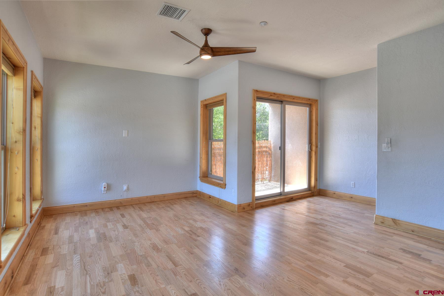 2855 Main Avenue, Unit A204 Durango, CO 81301 - Photo 7 of 45 a view of an empty room with wooden floor and a window