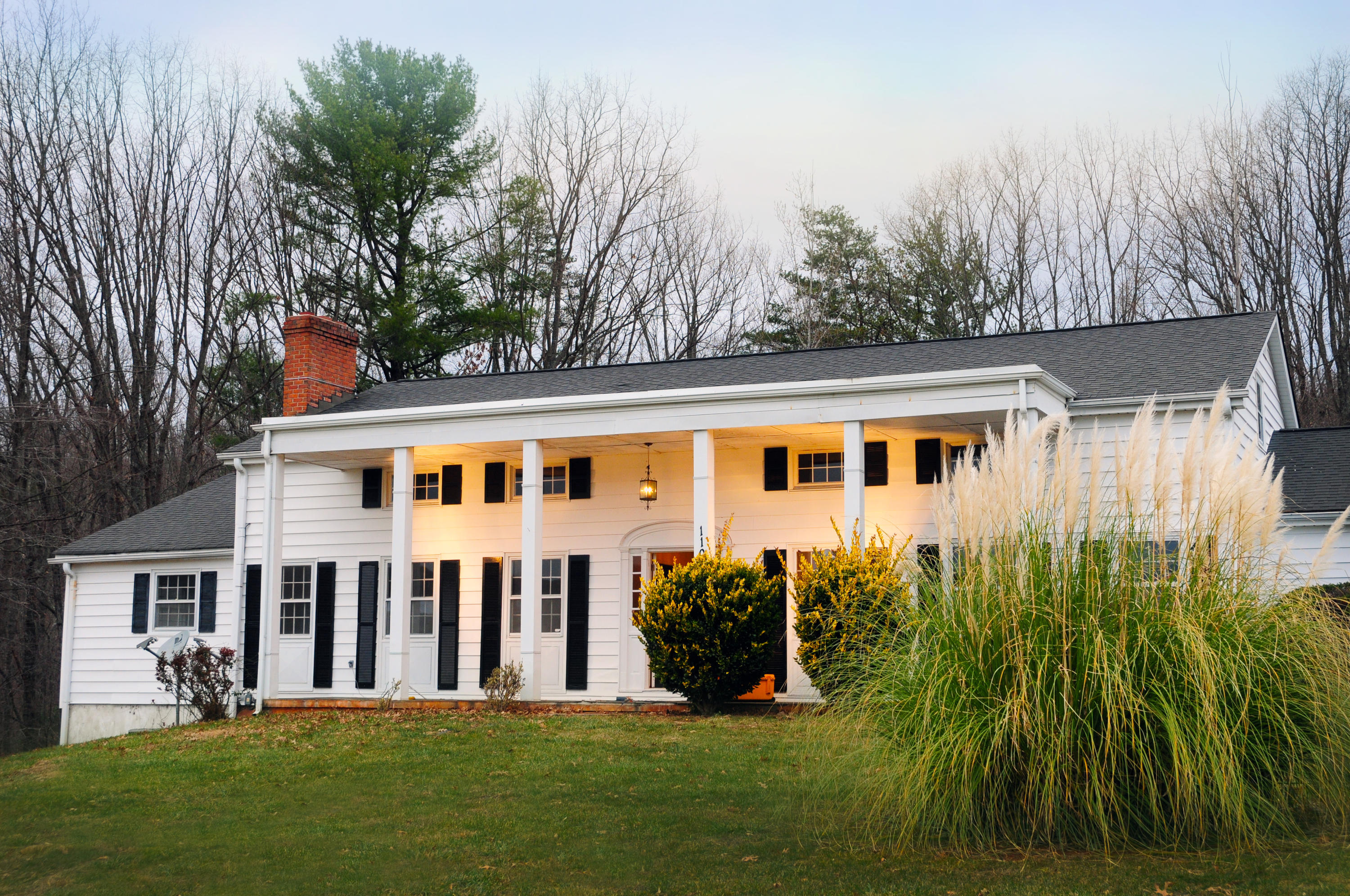 1107 Coopers Cove Road Hardy, VA 24101 - Photo 1 of 10 a front view of a house with a garden