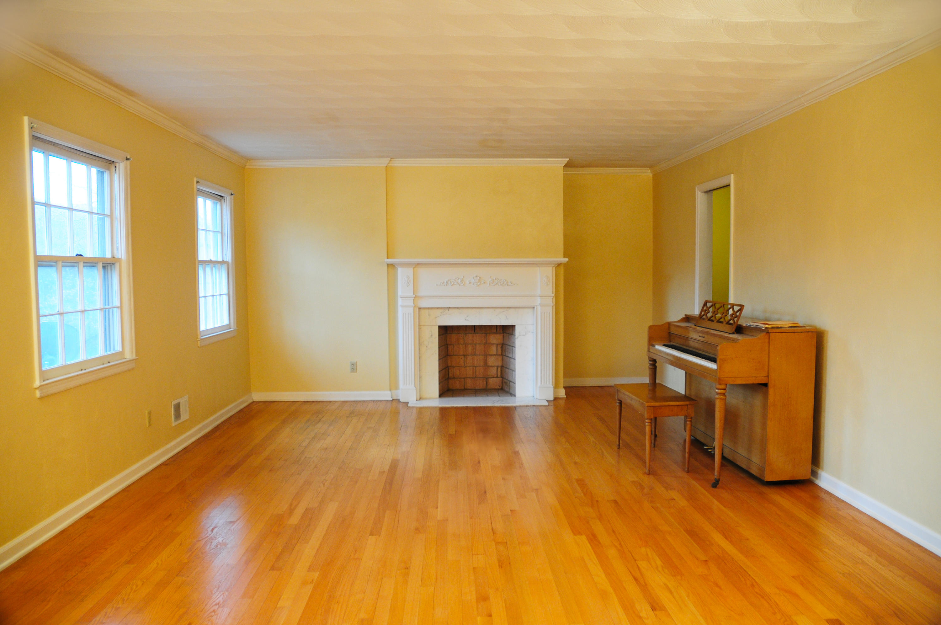 1107 Coopers Cove Road Hardy, VA 24101 - Photo 2 of 10 a view of empty room with a fireplace and wooden floor