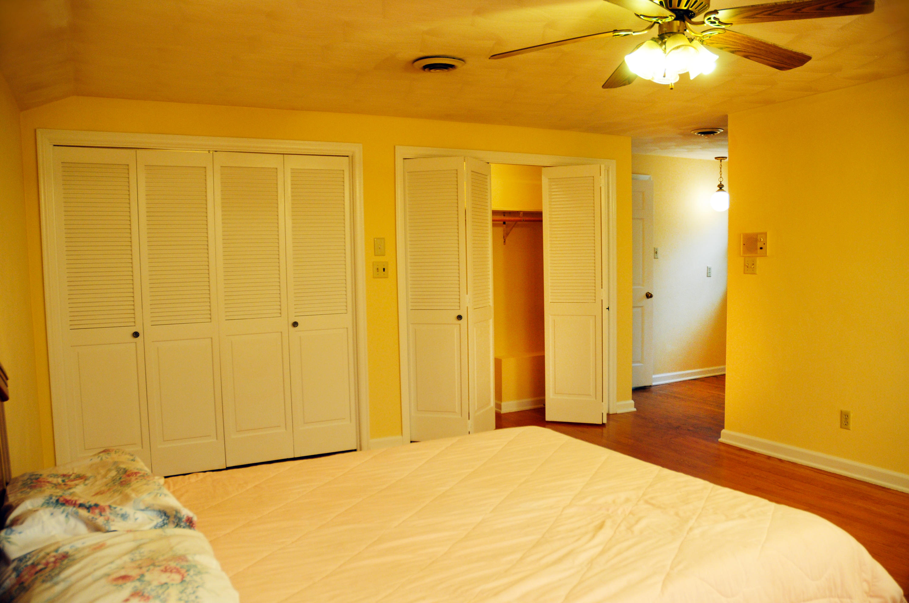 1107 Coopers Cove Road Hardy, VA 24101 - Photo 7 of 10 a bedroom with a bed and a chandelier