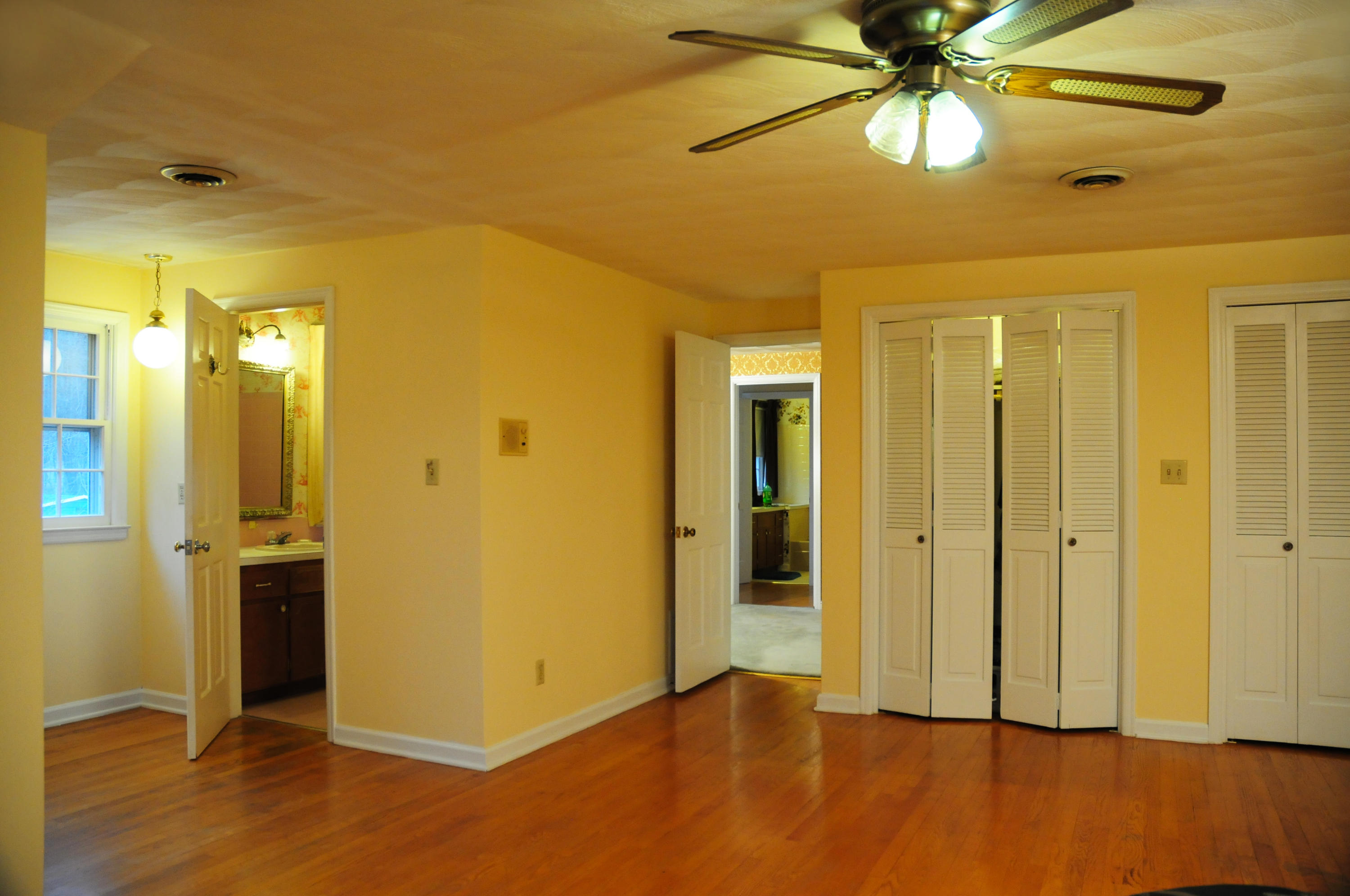 1107 Coopers Cove Road Hardy, VA 24101 - Photo 8 of 10 a view of a big room with wooden floor and chandelier fan