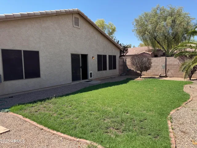 a backyard of a house with seating space