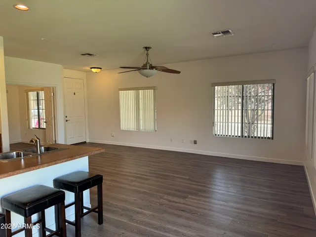 a view of a room with gym equipment and windows