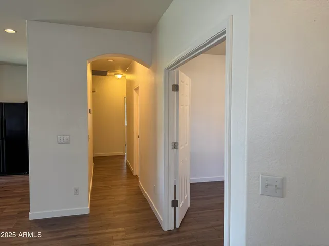 a view of a bathroom with wooden floor
