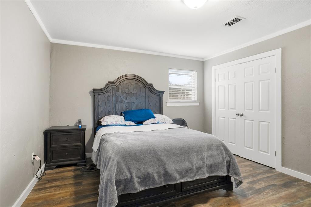 207 School House Road Paradise, TX 76073 - Photo 16 of 33 a bed sitting in a bedroom next to a window