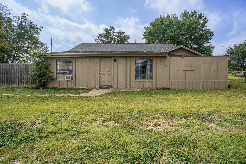 207 School House Road Paradise, TX 76073 - Photo 21 of 33 a front view of a house with a yard
