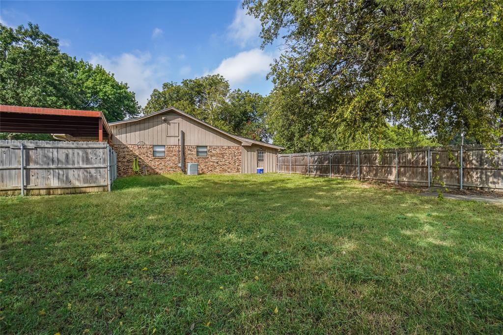207 School House Road Paradise, TX 76073 - Photo 22 of 33 a view of a house with a yard and sitting area