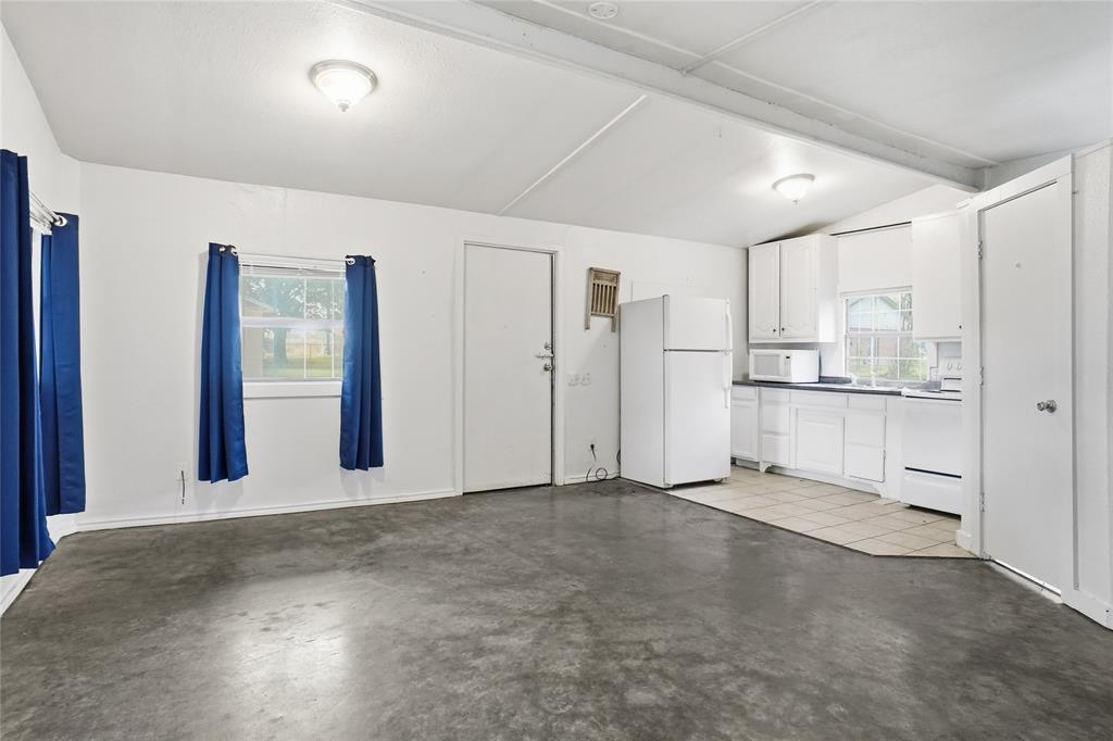 207 School House Road Paradise, TX 76073 - Photo 26 of 33 a view of an empty room with kitchen