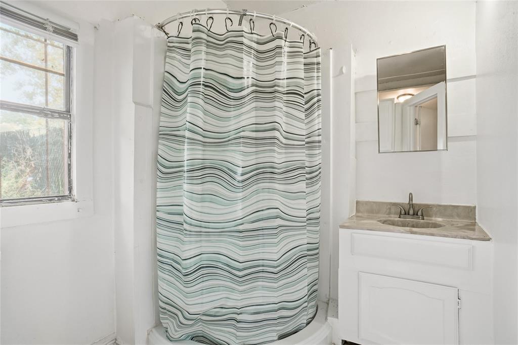 207 School House Road Paradise, TX 76073 - Photo 28 of 33 a bathroom with a sink and a mirror